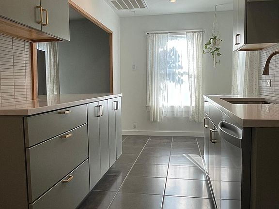 Room under the window for breakfast table & two chairs.