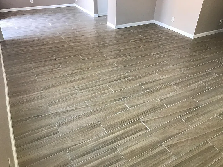beautiful wood grain style ceramic tile through entire condo.