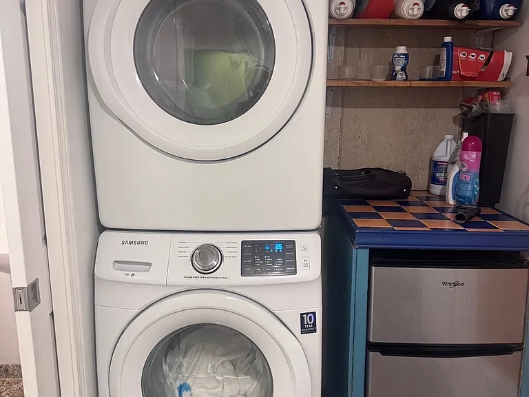 Laundry is located downstairs by the full bath and the "studio/home office" space