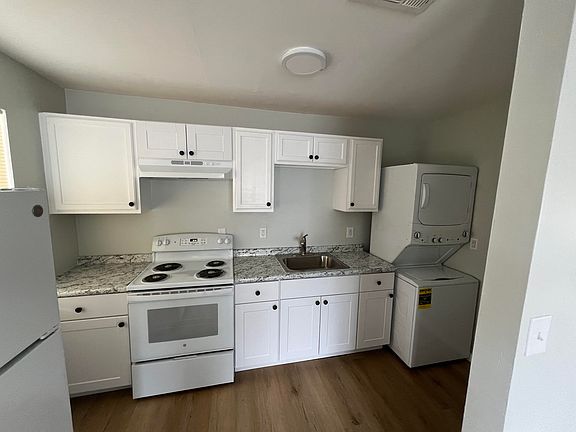 kitchen - all brand new appliances: stack on washer /dryer, stove, fridge