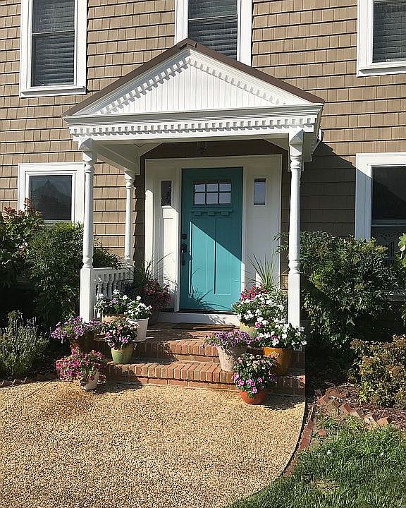Front door with flowers