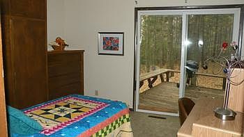 Second bedroom with a wonderful view to the wooded back yard.
