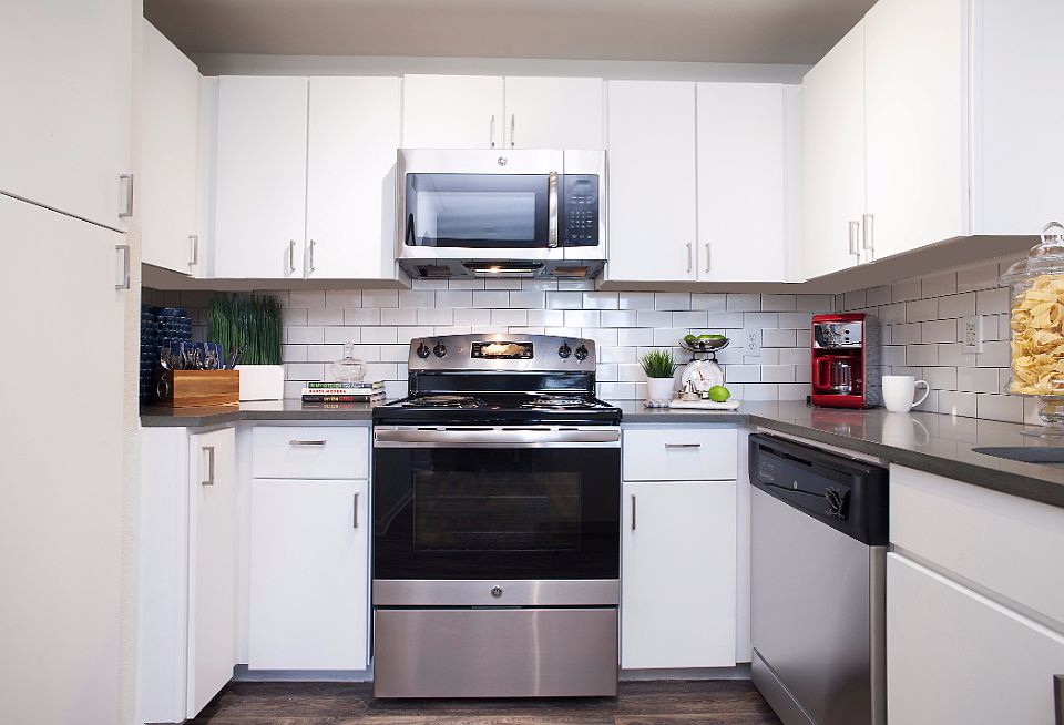 Upgraded Kitchen with White Flat Front Cabinets