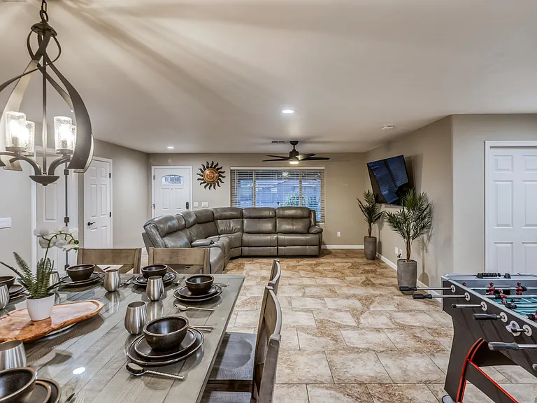 Spacious open-concept living area with upgraded tile flooring and modern finishes throughout.