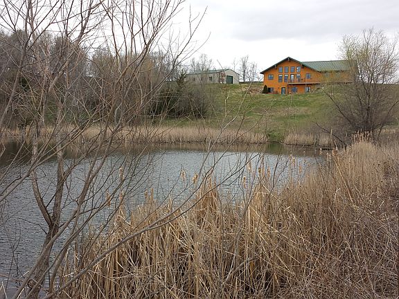 House across pond view.