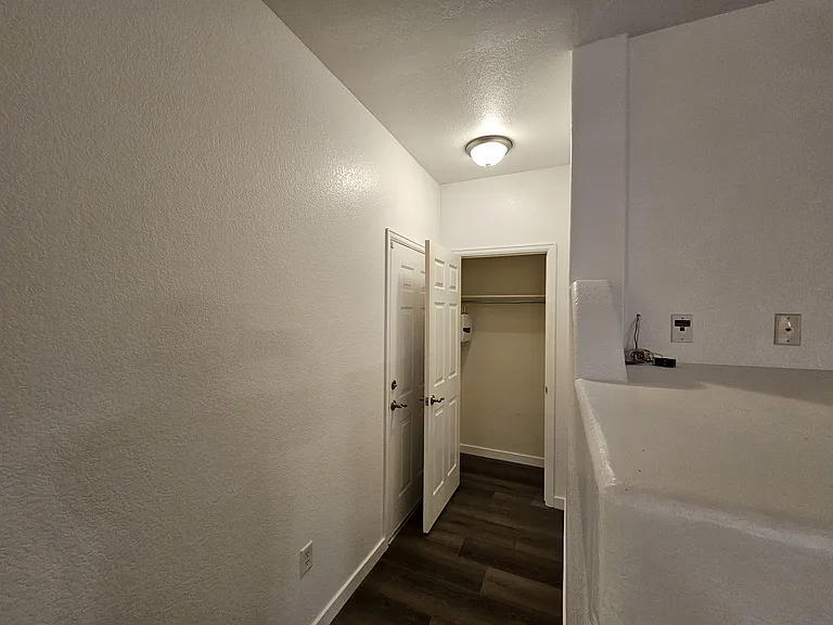 Attached garage entry with hallway closset
