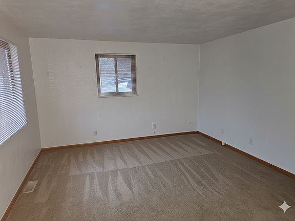 Living room with Gorgeous New Carpeting and luscious pad