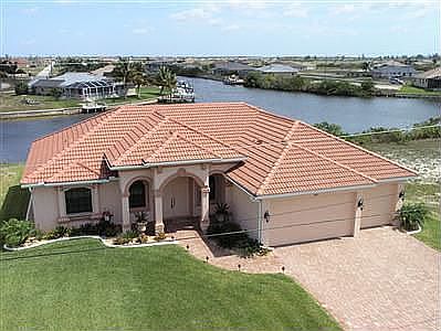 Waterview with dock in back yard.