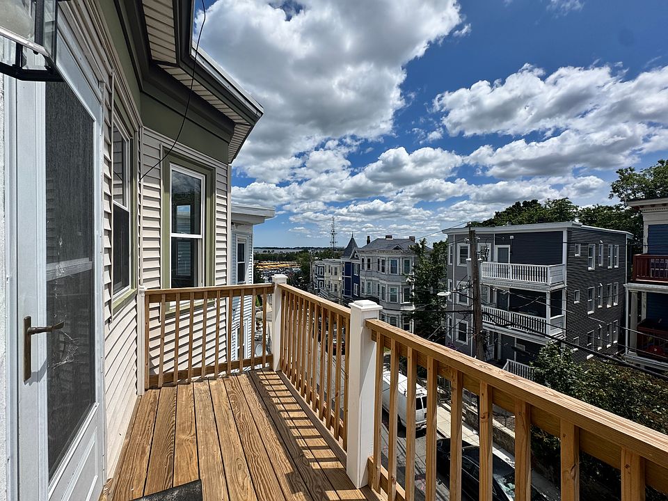 Get a tan on your south-facing front balcony with a view of Dorchester Bay
