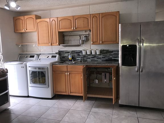 Kitchen with water heater on demand