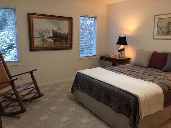 Roomy furnished bedroom with spacious walk-in closet.