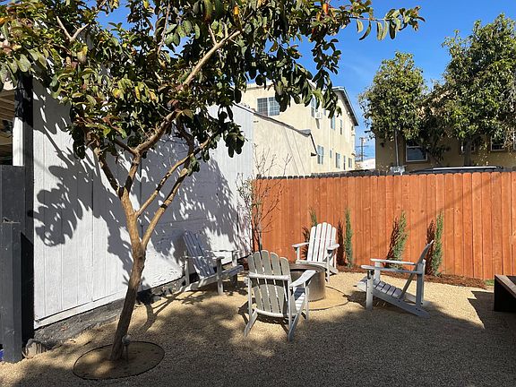 Newly remodeled backyard with firepit