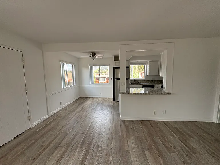 Open concept eat in kitchen and living room.