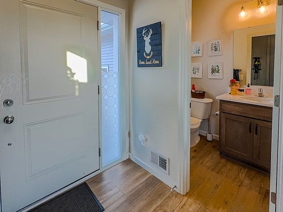 1/2 bath off front entrance, far from kitchen