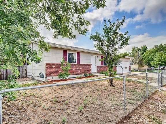 FENCED FRONT YARD, WINDOW SHUDDERS