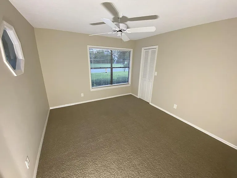 Front bedroom with large walk-in closet.