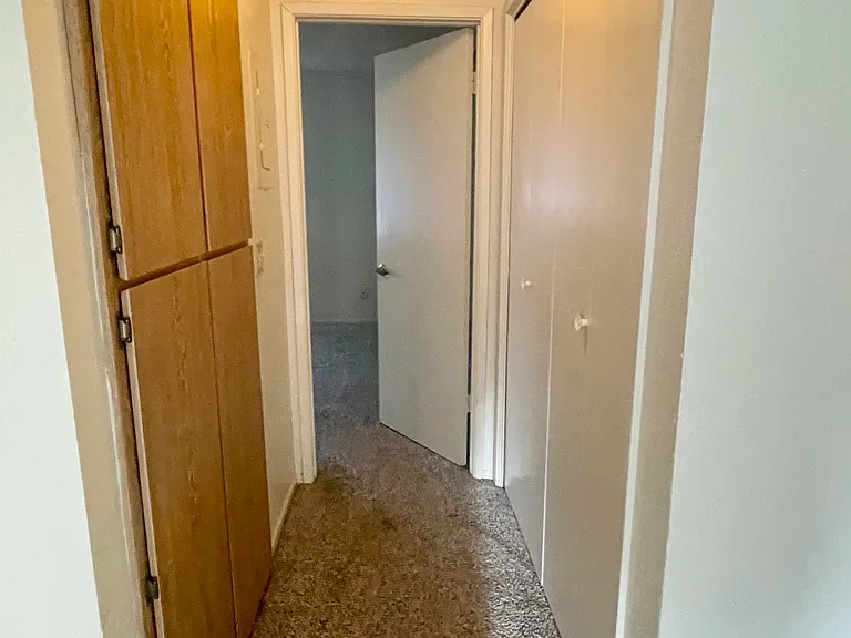 1-Bed / 1-Bath Classic unit Hallway With Washer/ Dryer Hookup & Storage.