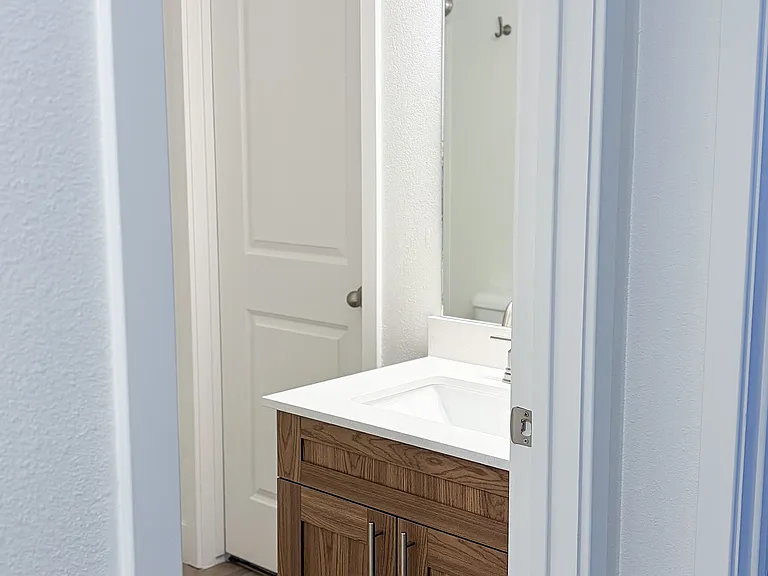 Updated bathrooms showcase modern cabinetry, stylish fixtures, and clean contemporary finishes.