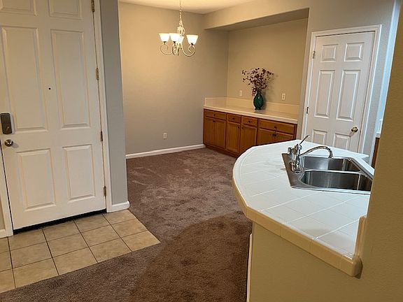 Kitchen Sink, Pantry & Dining Room w/Cupboards