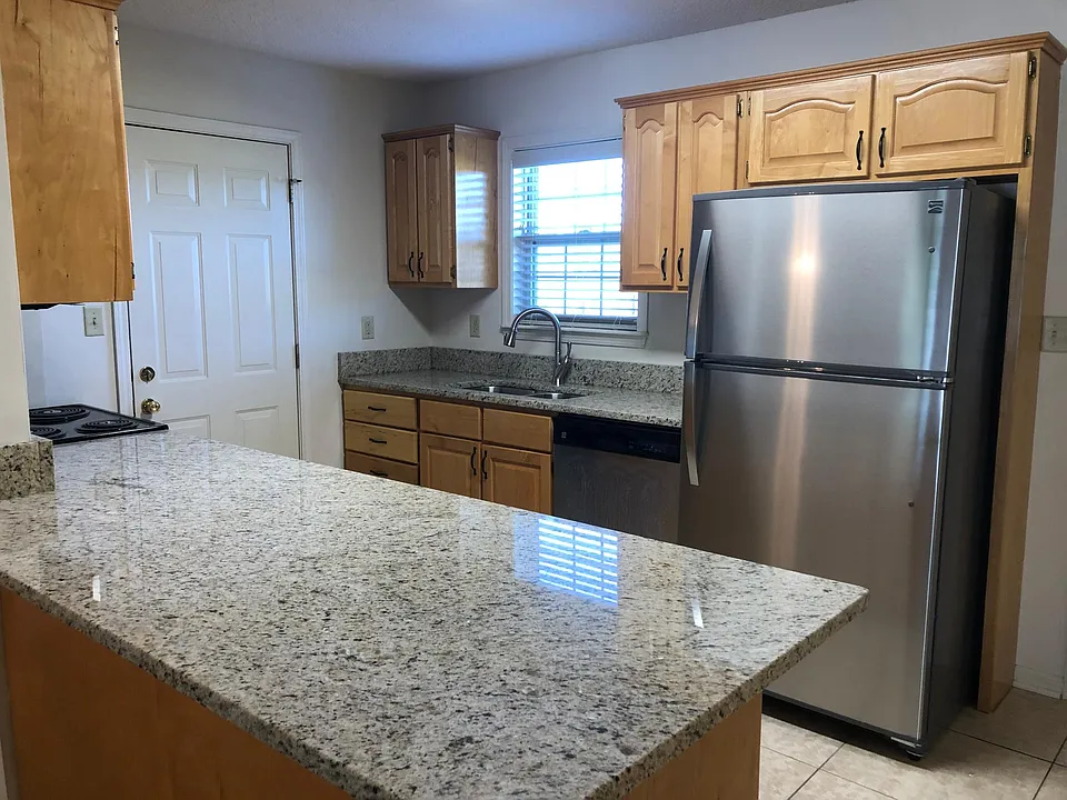Granite counter tops and stainless steel appliances refrigerator, dishwash. built in microwave and washer dryer hook up.