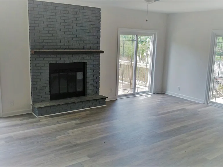 family room-Fireplace
sliding doors to two separate decks