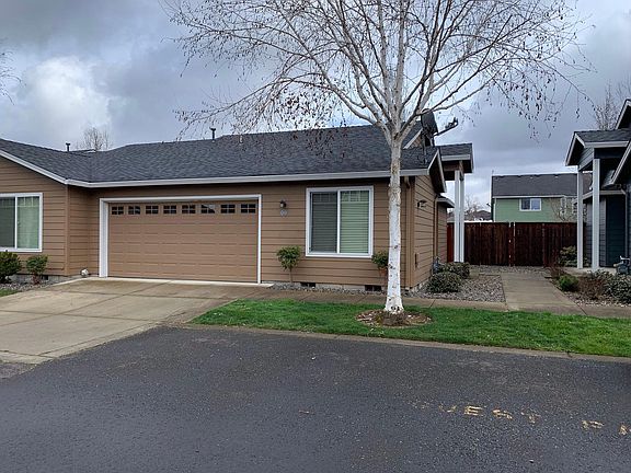 Front with double garage.