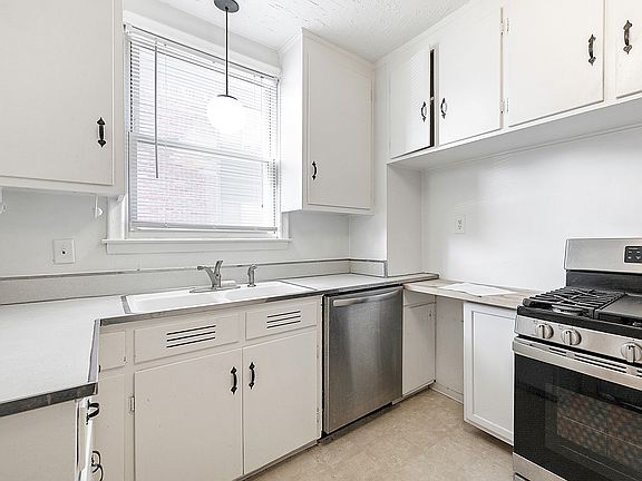 Kitchen with new dishwasher and stove