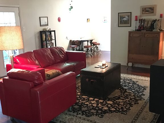 Spacious living area opens to screen porch - great for enter