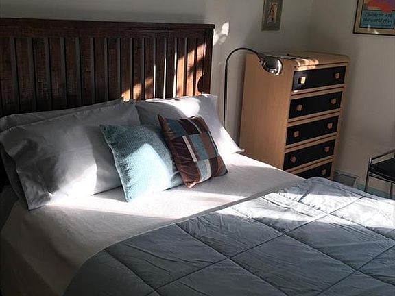 Blue bedroom in the front of the unit