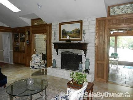 Great room with fireplace.
						:
						Hand carved mantle over fireplace