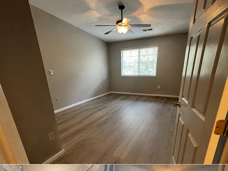 Primary bedroom with bathroom attached and walk-in closet