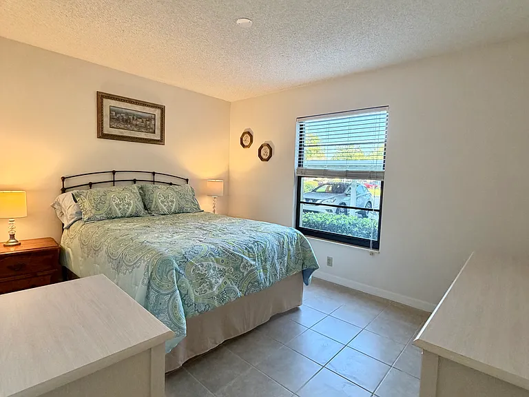 Entering spacious guest bedroom w/ walk-in closet
