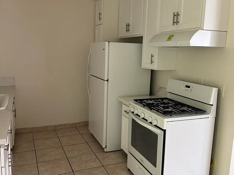 Kitchen with stove and fridge