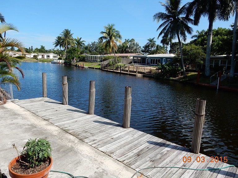 View of canal with fixed bridge ocean access