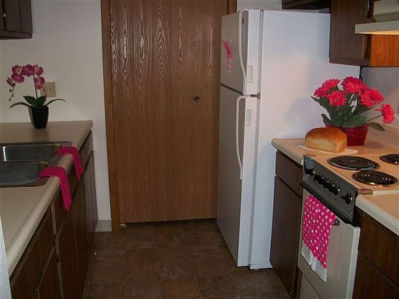Galley style kitchen with walk in closet/pantry area