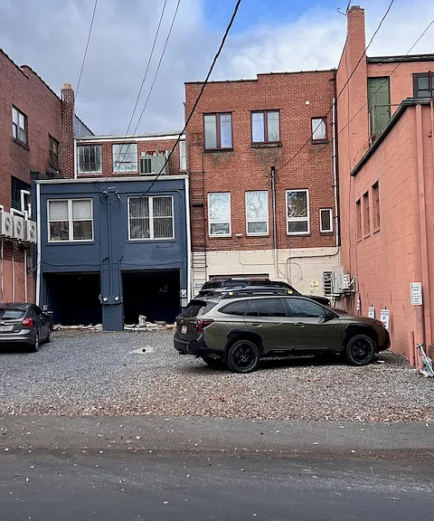 Reserved parking space behind apartment.