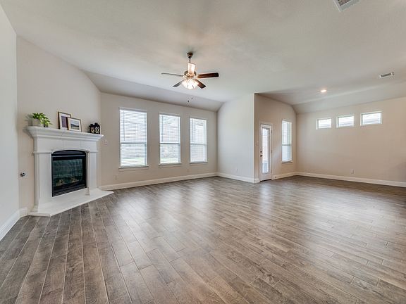 Living area with breakfast nook and a fireplace