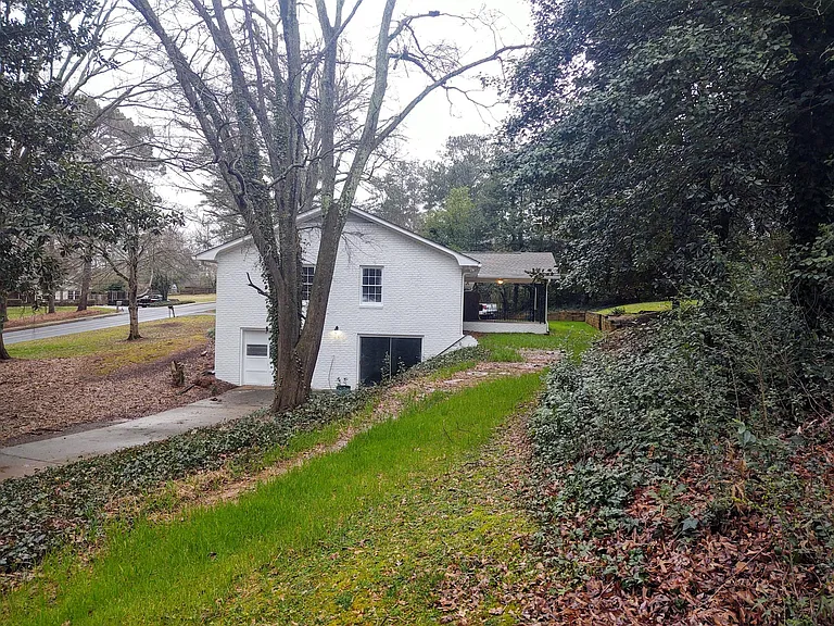 View of Lower Driveway and Entrance to Basement