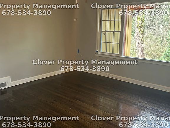 Large living room with hardwood floors throughout.