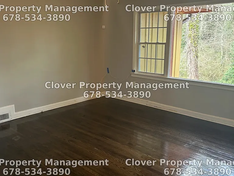 Large living room with hardwood floors throughout.