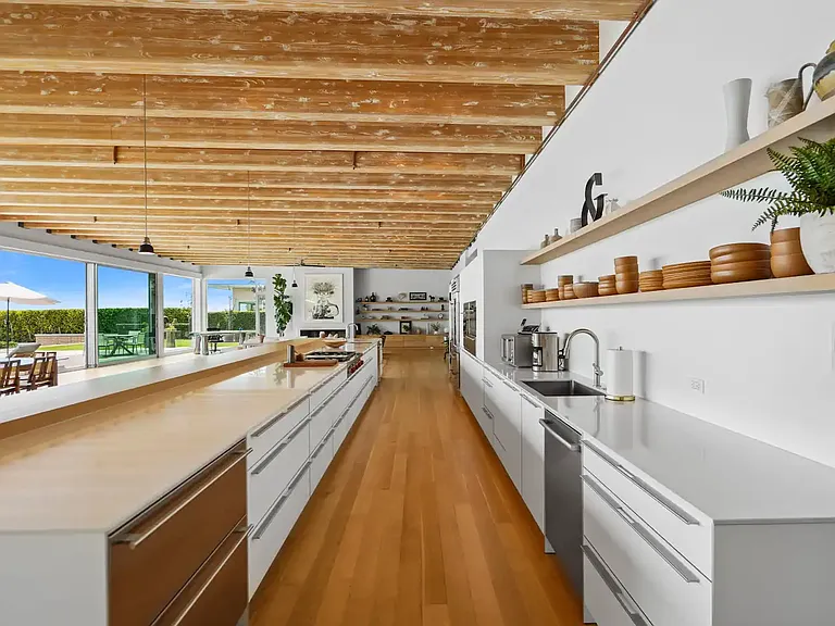 Central kitchen island for additional prep space and casual dining.