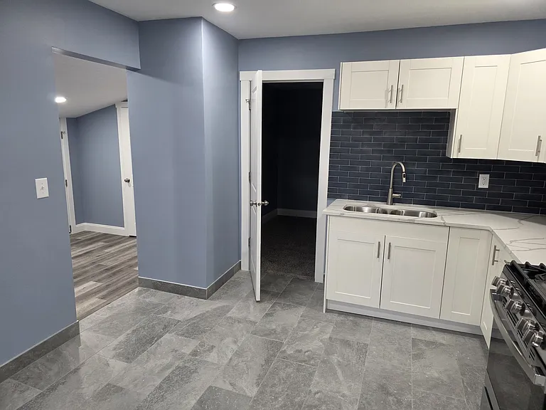 Kitchen with Bedroom Entry to the Right and Living Entry to the left
