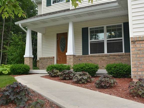 Pillars adorn the front entry of this home.