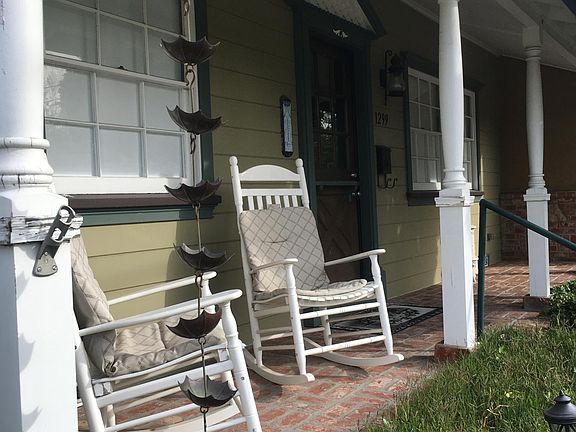 Okay now, you HAVE to have white rocking chairs on the porch of a Colonial Cottage home with a nice American flag and an entertaining rain chain to enjoy. Right? Rock away~ahhh remembering those good 'ol days when you had the time to do just that. Well,