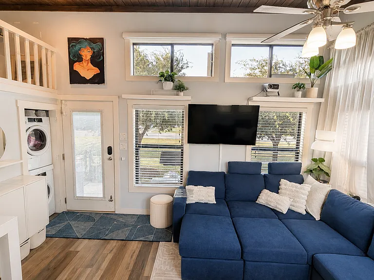 Movie night or game day? Enjoy a projector, smart TV, and blackout shades for the perfect setup.