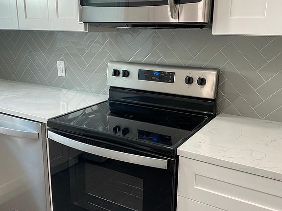 Kitchen stove and tile backsplash