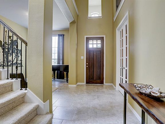 This grand entryway couldn't say "Welcome" any better! High ceilings and so much open space!