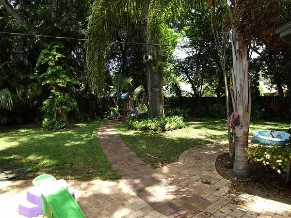 Large fenced zen like area with matured landscape yard for k
