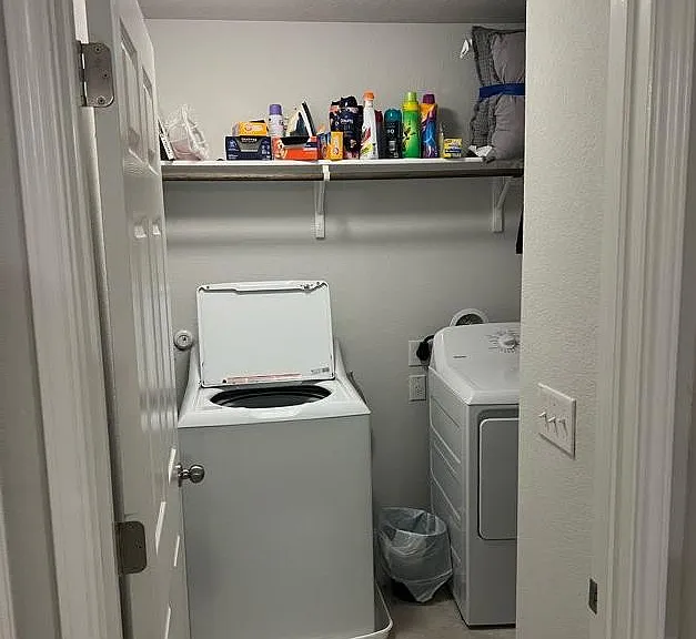 Laundry room with extra storage space for cleaning supplies, laundry baskets, etc