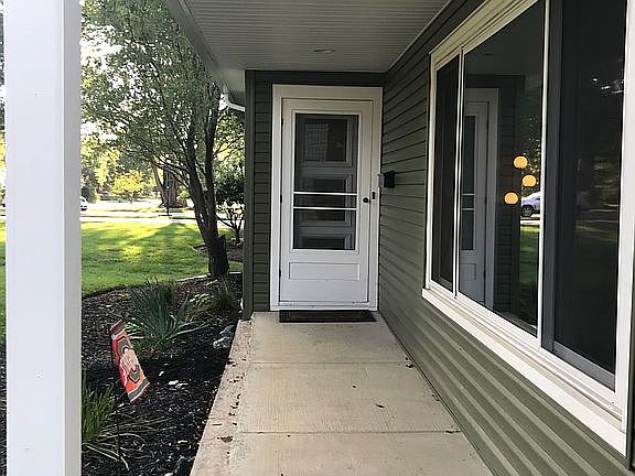 Front entrance with storm 